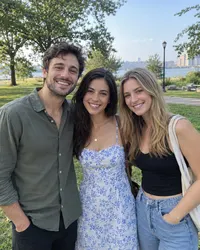 Three friends standing in one photo — too many faces for a single still spot
